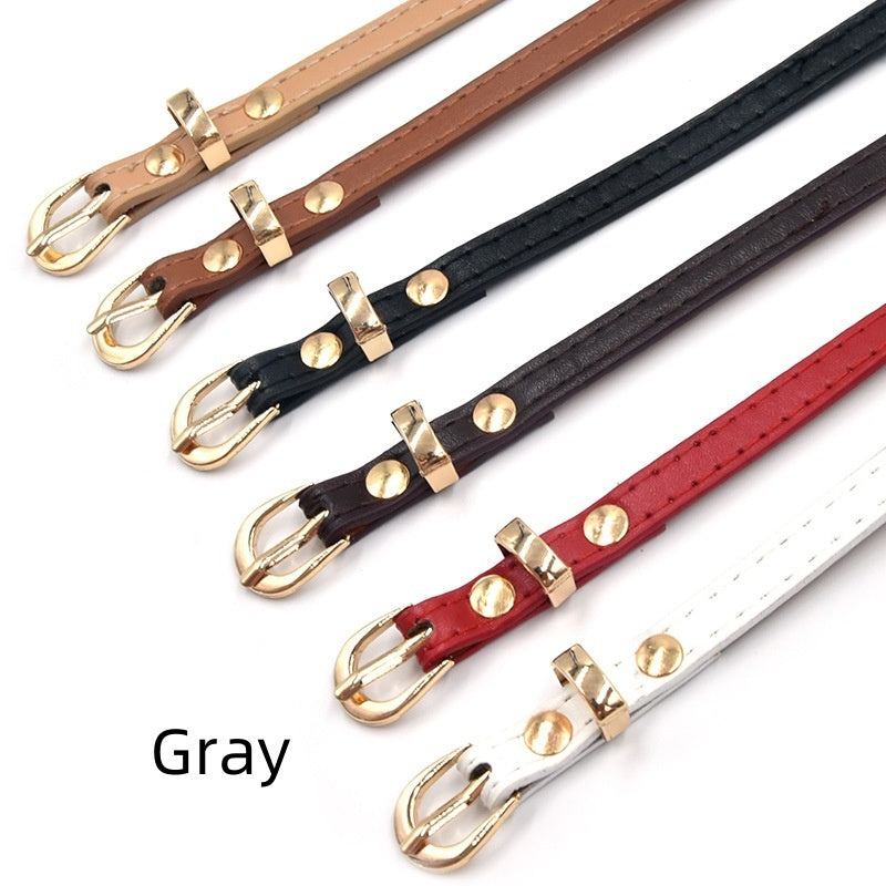 Spring And Summer Children's Thin Belt Stylish Simple And Versatile Dr
 Product information:
 
 Width: thin (&lt;2cm)
 
 Color: black, white, camel, red, khaki, brown, gray, pink, bright blue
 
 Material: imitation leather
 
 Belt buckClothing & Apparel for WomenShoparamas.comVersatile Dress Matching Clothing Belt