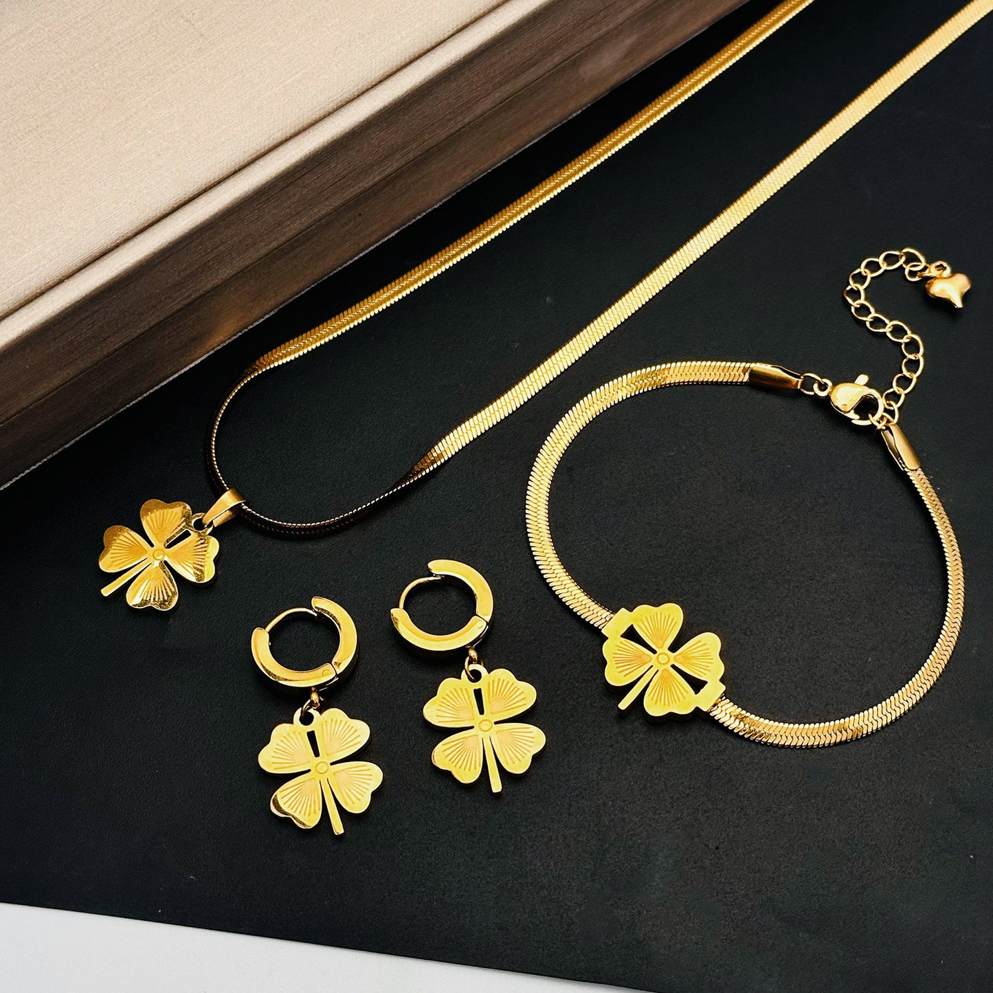 Women's Fashion Temperament Titanium Steel No Fading Clavicle Chain Ea
 Product information:
 
 Treatment Process: Electroplating
 
 Color: four-leaf clover necklace Golden-896, four-leaf clover bracelet gold 5155, earrings gold 7619
 Women's JewelryShoparamas.comFading Clavicle Chain Earrings Suit